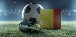 imagem gráfica de uma bola, um apito e dois cartões, representando as regras do futebol
